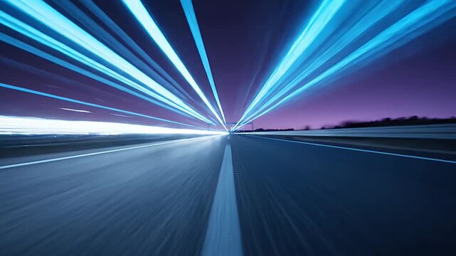 High speed blue motion trails on dark highway.