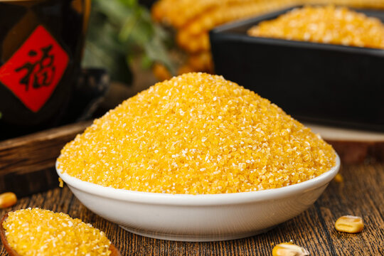 Nutritious Yellow Corn Meal Grits in White Bowl - Traditional Cooking Ingredient for Porridge and Healthy Food Preparation