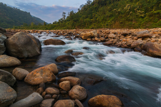 Jaldhaka River and stones at river bed, flowing through India, Bhutan, and Bangladesh. Originating from Kupup Lake in East Sikkim. Joldhaka river, Jhalong - Dooars , north bengal - West Bengal, India.