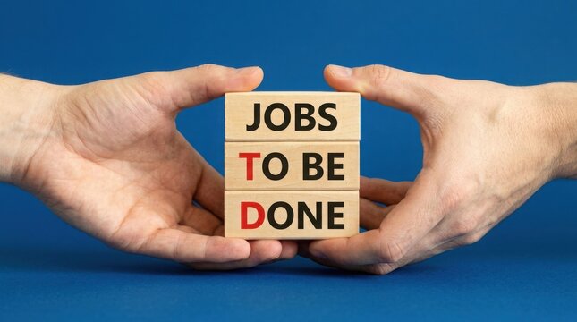 Hands holding wooden blocks with the text jobs to be done on a blue background