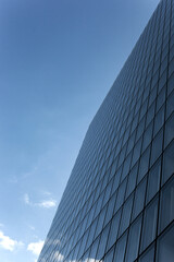 Fototapeta premium Modern architecture and cloudy blue sky on background