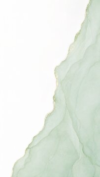 Green and gold marble texture with irregular edges on a white background
