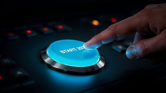 Hand pressing illuminated start button with 2077 text
