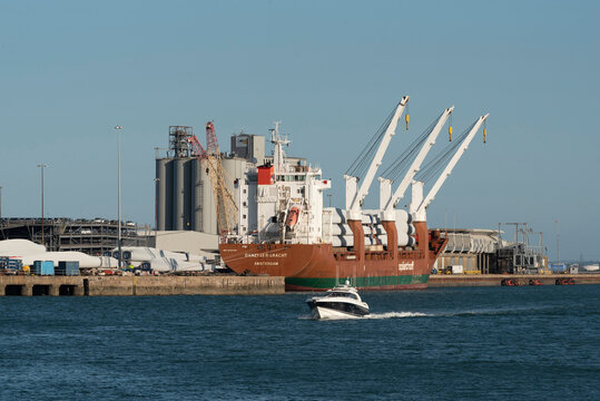 Southampton southern England UK. 26.07.2026. A massive cargo vessel is moored at a port facility, in Southampton its deck laden with components for wind turbines, ready for transport across the sea