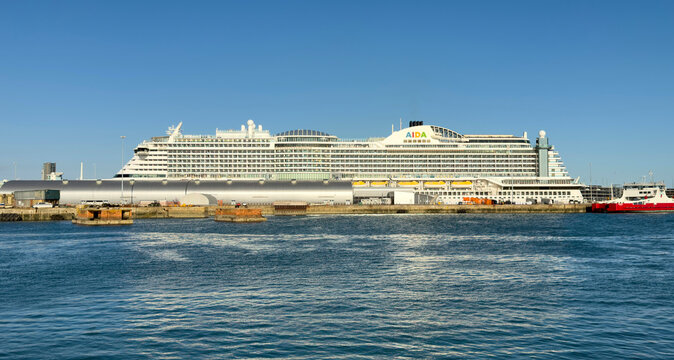 Southampton Doxks southern England UK. 26.07.2026. A large white passenger vessel with multiple decks and balconies is docked under a bright blue sky, showcasing the distinctive AIDA Perla vessel.