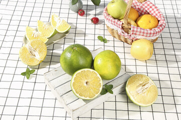 Fresh Green Grapefruit and Citrus Fruits Healthy Arrangement on White Tiles © TranVan