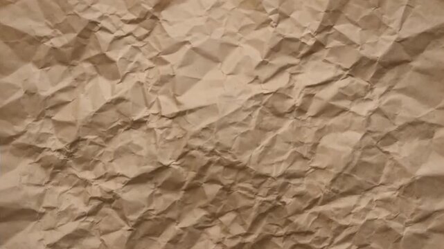 Abstract texture of crumpled brown craft paper background.