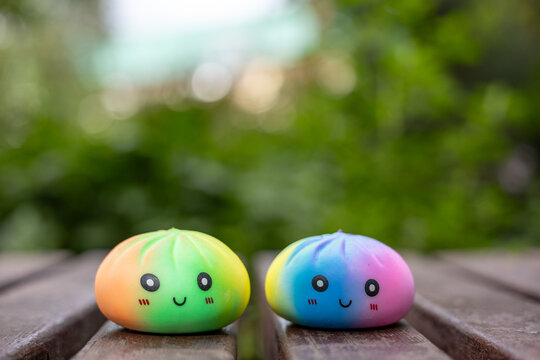 Two cute colorful squishy stress relief toys with copy space outdoors