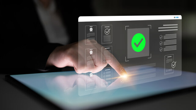 A business professional interacts with a digital tablet showcasing graphics and checkmarks, symbolizing innovative technology for efficient document management in a modern workspace. Cyphers