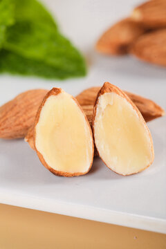 Peeled Almonds Cut in Half Showing Interior - Healthy Nuts Snack Food