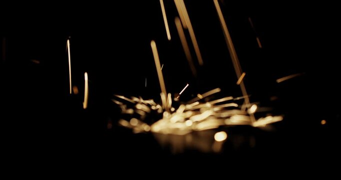 Subtle particle dust sparks floating over dark atmospheric background