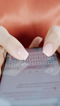 Female hands using smart phone to type or browse in vertical