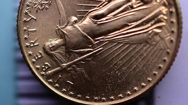 Gold coin macro close up on the liberty statue macro moving spotlight, authentic gold close up, contrast