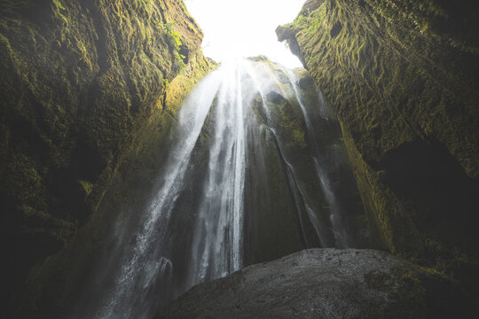 Gljufrafoss pours through a narrow mossy canyon in South Iceland