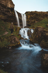 Icelandic waterfall, where silky cascades flow between moss-covered volcanic rocks © Fauren