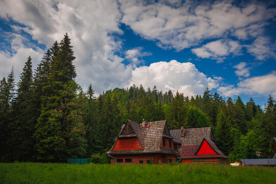 Rustic red wooden cabin in Zakopane, Tatras mountains