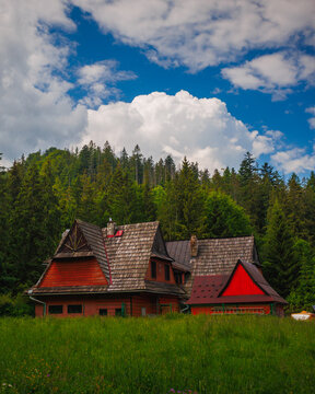 Rustic red wooden cabin in Zakopane, Tatras mountains