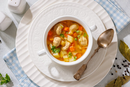 Clear American chicken meatball soup with veggies