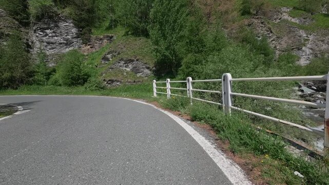Scenic mountain road climbing to Colle dell'Agnello in Cuneo Province, Italy