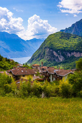 Obraz premium Village of Ville del Monte on the heights of Riva del Garda with a panoramic view of Lake Garda and the surrounding mountains, Trentino