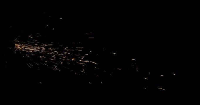 Intense dust sparks overlay with flying fire embers on black background