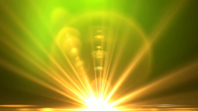 Radiant yellow lens flare burst against dark background.