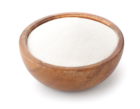 Baking soda in wooden bowl isolated on white