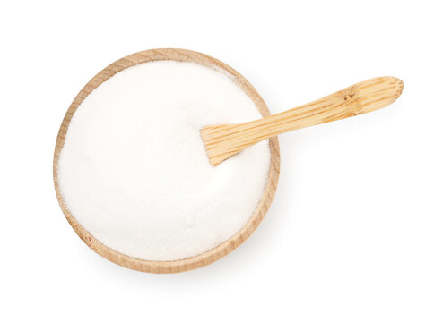 Baking soda and spoon in wooden bowl isolated on white, top view