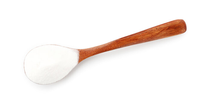 Baking soda in wooden spoon isolated on white, top view