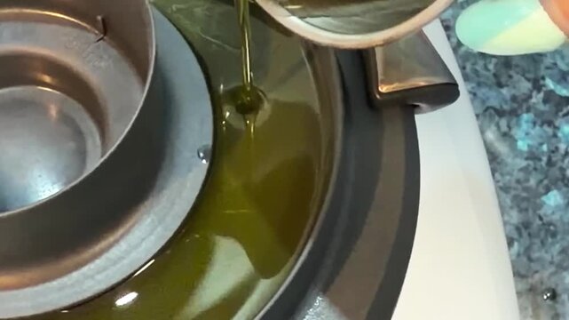Enjoying the art of making salmorejo with olive oil in a cozy kitchen setting
