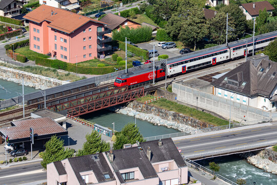 SBB double-decker train over the Dranse River in Martigny