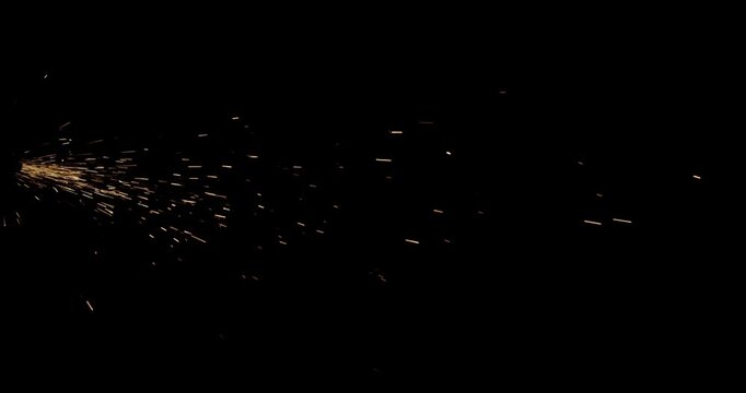 Fiery dust sparks floating upward with glowing ember particles on dark texture