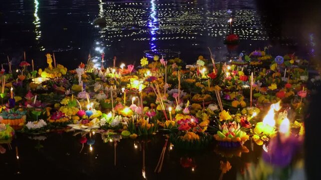 Floating Krathong waste polluting river water after Loy Krathong festival night in Thailand.