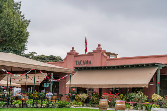 Ica, Peru, July 04, 2026: Exterior of Tacama wine tourism destination in Ica, Peru, featuring traditional architecture, gardens, outdoor seating and decorative barrels.