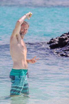 Man stretching in water, galapagos