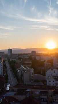 Beautiful sunset over the city in a time-lapse over the city of Nis, Serbia, in a vertical video