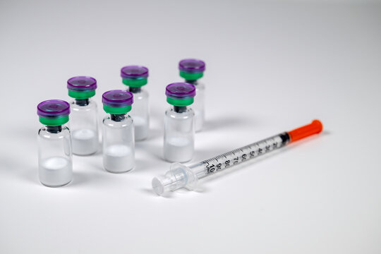 Peptide vials and syringe(s).