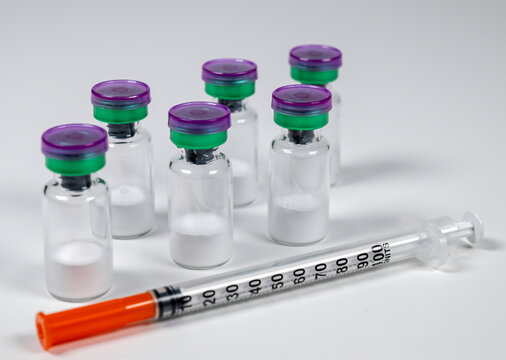 Peptide vials and syringe(s).