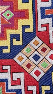 Colorful tribal pattern corner with geometric woven textile design