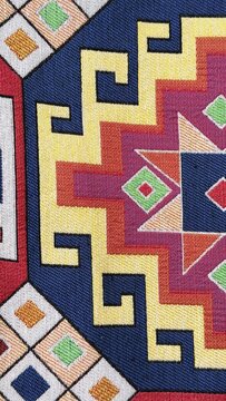 Colorful tribal textile pattern with geometric ethnic ornament design