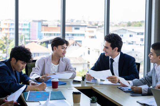 Successful happy workers Group of business people with Multiethnic workers with in company workers Group of asian business people and support Teamwork in the meeting room at modern office.