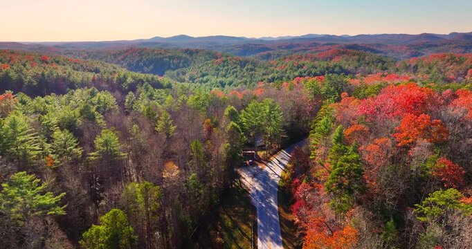 Blue Ridge Parkway in autumn. Mountain pass road between dense woods in seasonal colors in North Carolina.