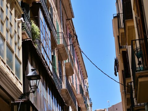 Narrow Historic Alleyway with Classic Balconies and Street Lamp in Palma
