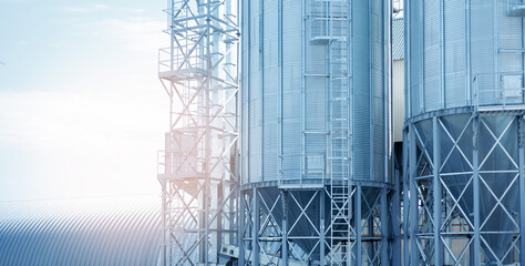 Agricultural Industrial silos for storage and drying of grains, corn, wheat, soy, sunflower with sunlight. © Parilov