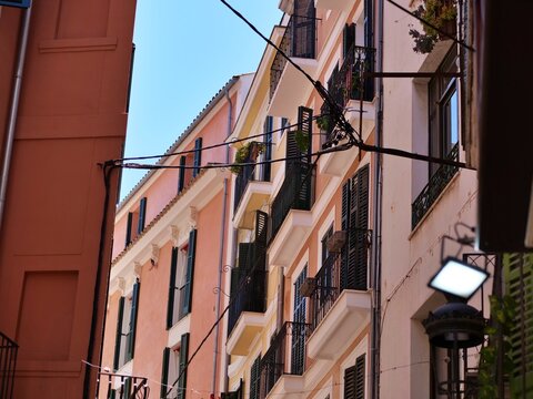 Pastel Pink Facades and Traditional Balconies in Palma Old Town