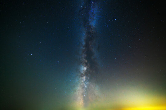 Colorful bright Milky Way galaxy on the starry sky.