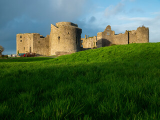 Stunning old fortress castle in Roscommon town, Ireland. Famous tourist attraction with nice green park and amazing view. Powerful stone wall and towers to protect important people. Irish history. © mark_gusev