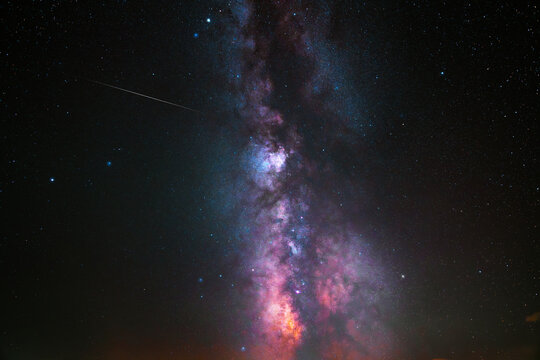 Colorful bright Milky Way galaxy on the starry sky.