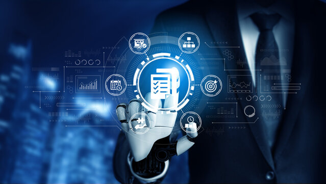 Futuristic Businessman Using Robotic Hand to Interact with Virtual Data Interface in Modern Office Setting. Entropy.