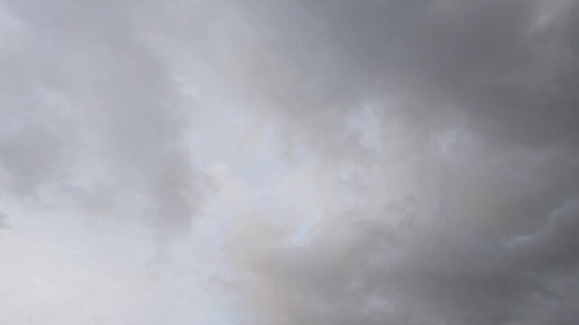 Curious stratocumulus clouds in the sky at sunset